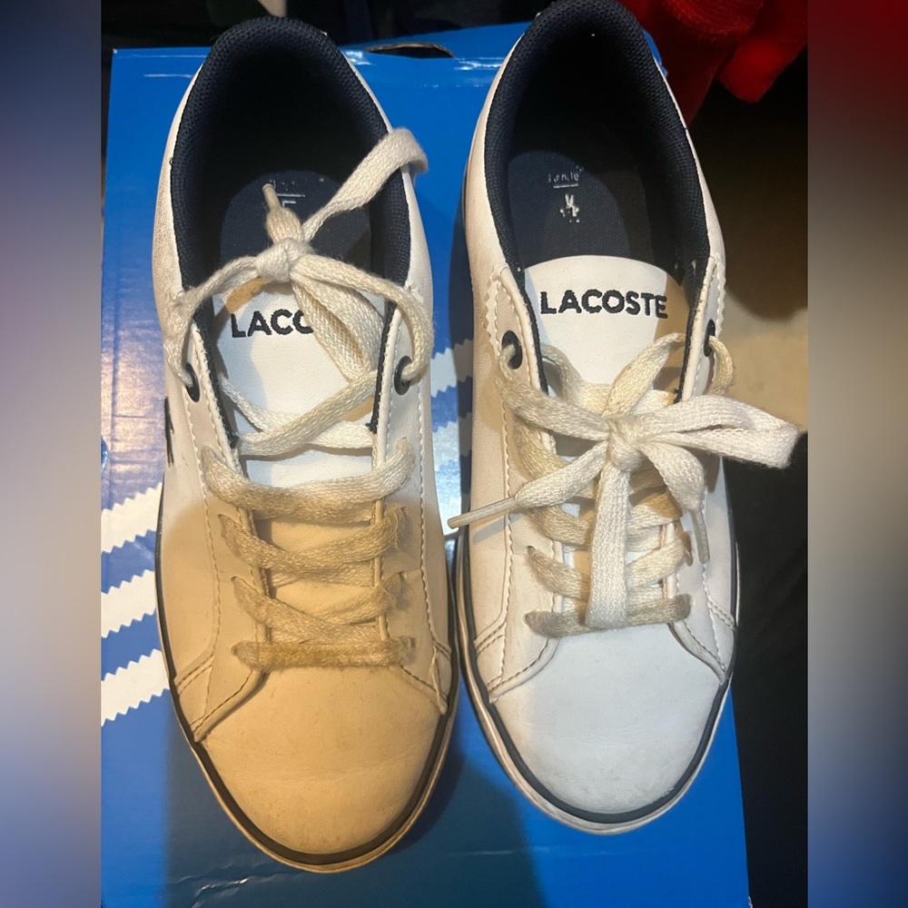Unisex white lacoste shoes. Good shape. See pics
